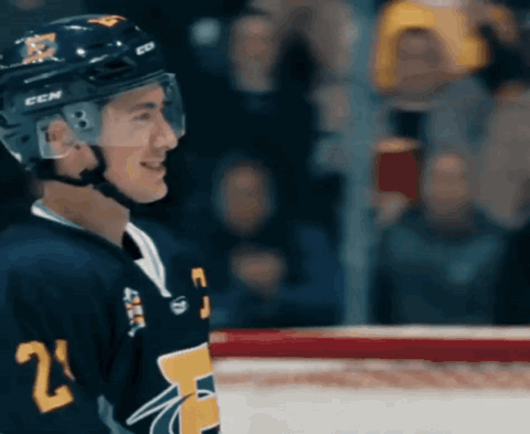 shane hollander and ilya rozanov hugging and celebrating on the ice