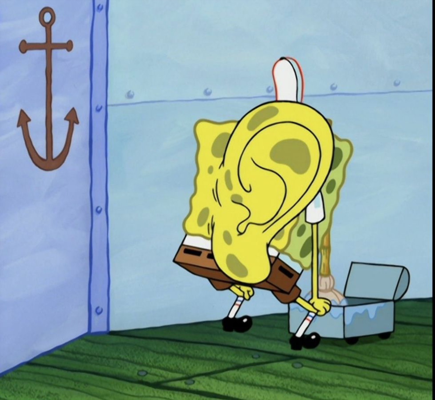 SpongeBob bent over scrubbing, his ear comically oversized