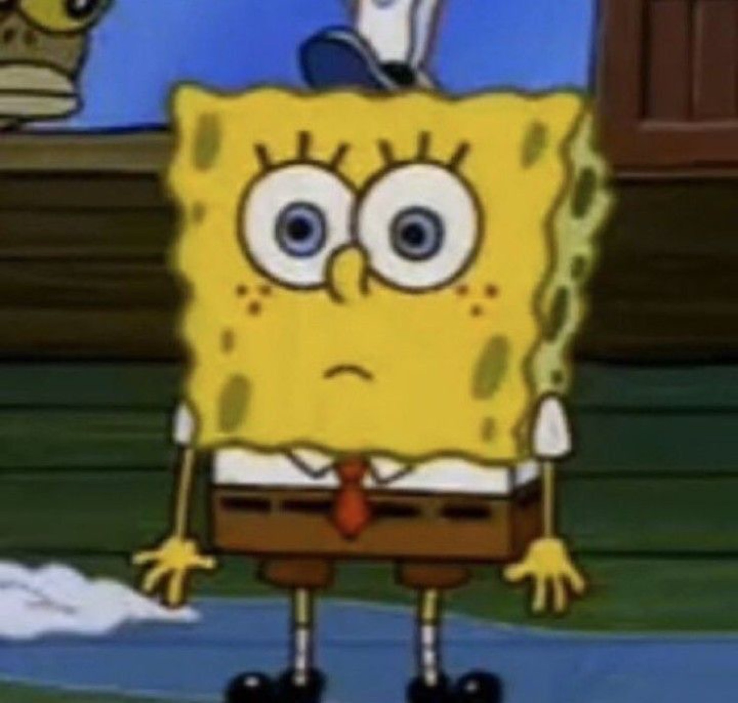 SpongeBob standing arms down with a small sad frown and worried eyes