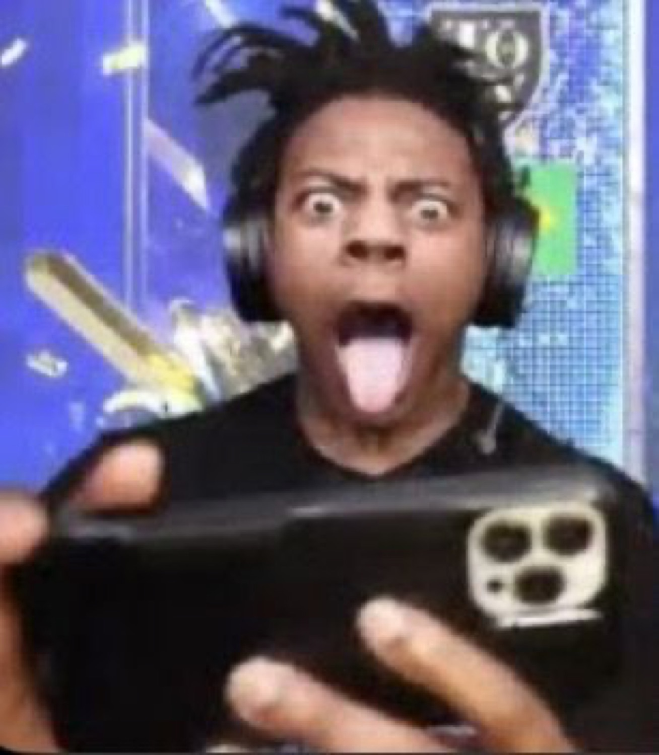 Streamer in headphones with bulging eyes and tongue out, phone shoved at the camera