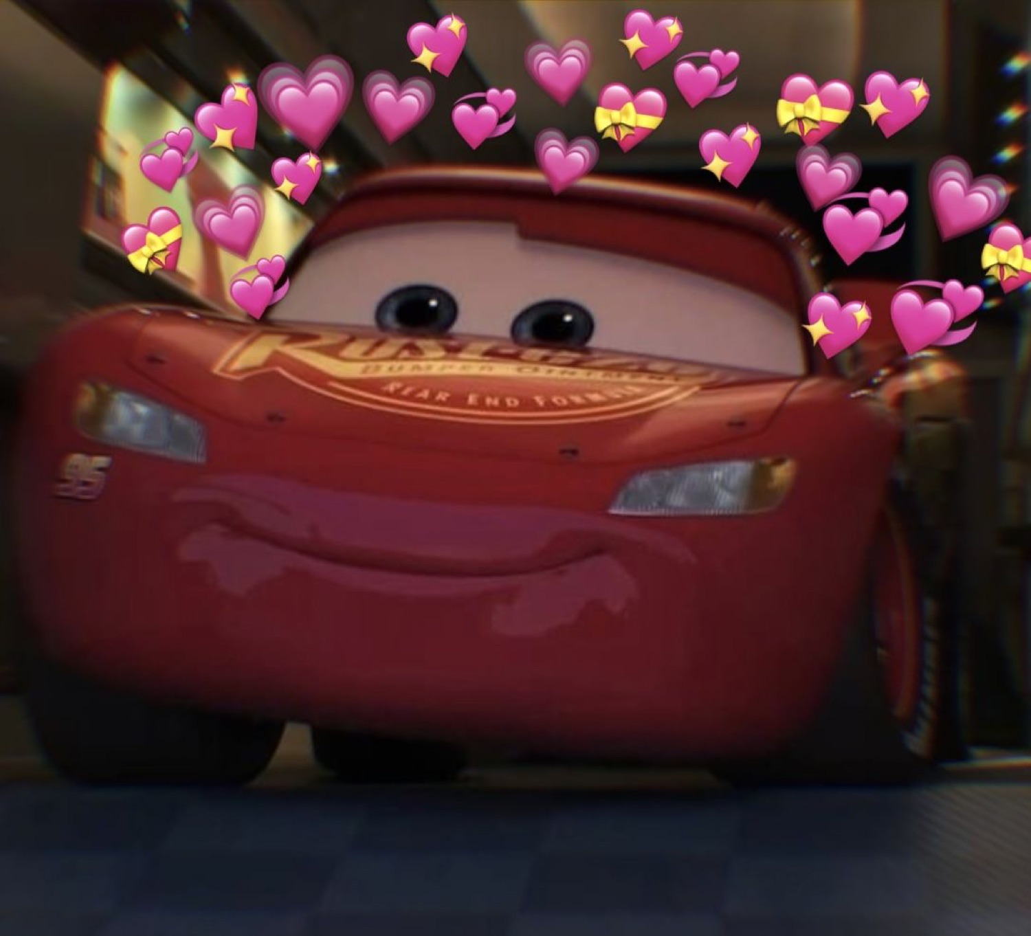 Lightning McQueen surrounded by pink hearts