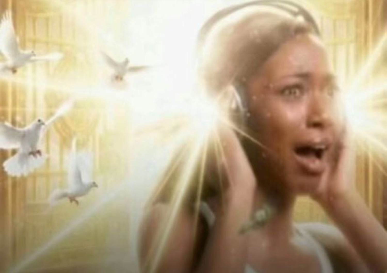 Woman gasping with hands on headphones as doves and golden light explode around her