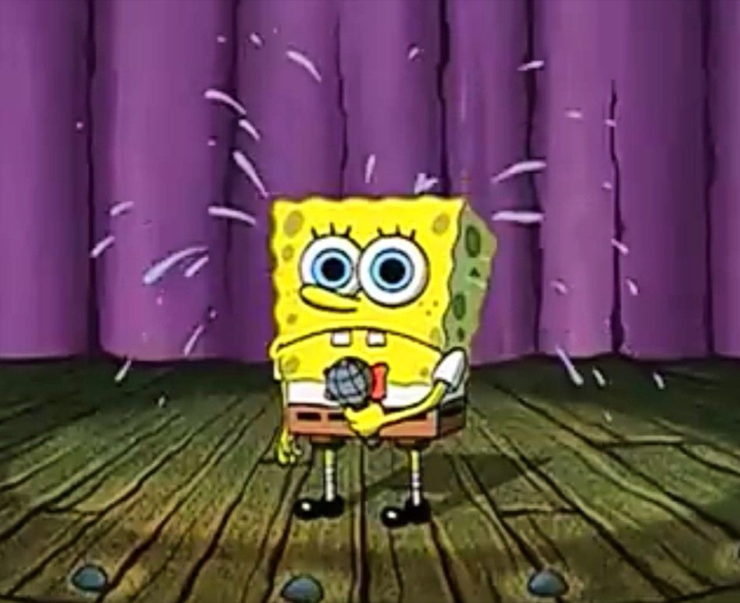 SpongeBob standing alone on stage sweating nervously with a microphone