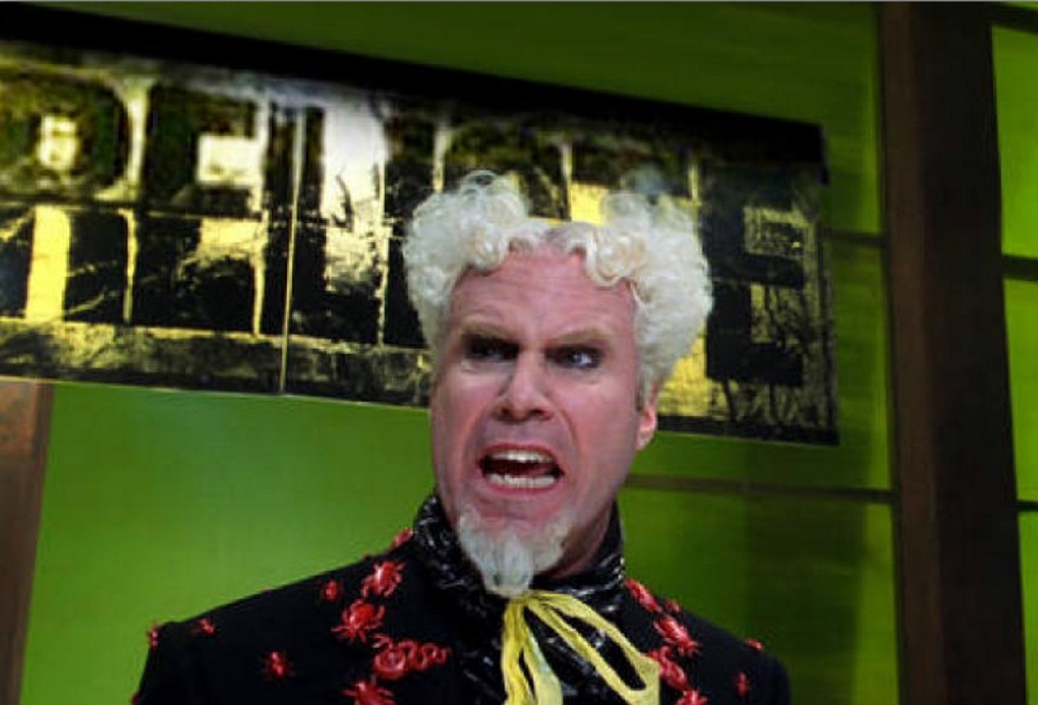 Will Ferrell as Mugatu in a white wig baring his teeth in an angry snarl