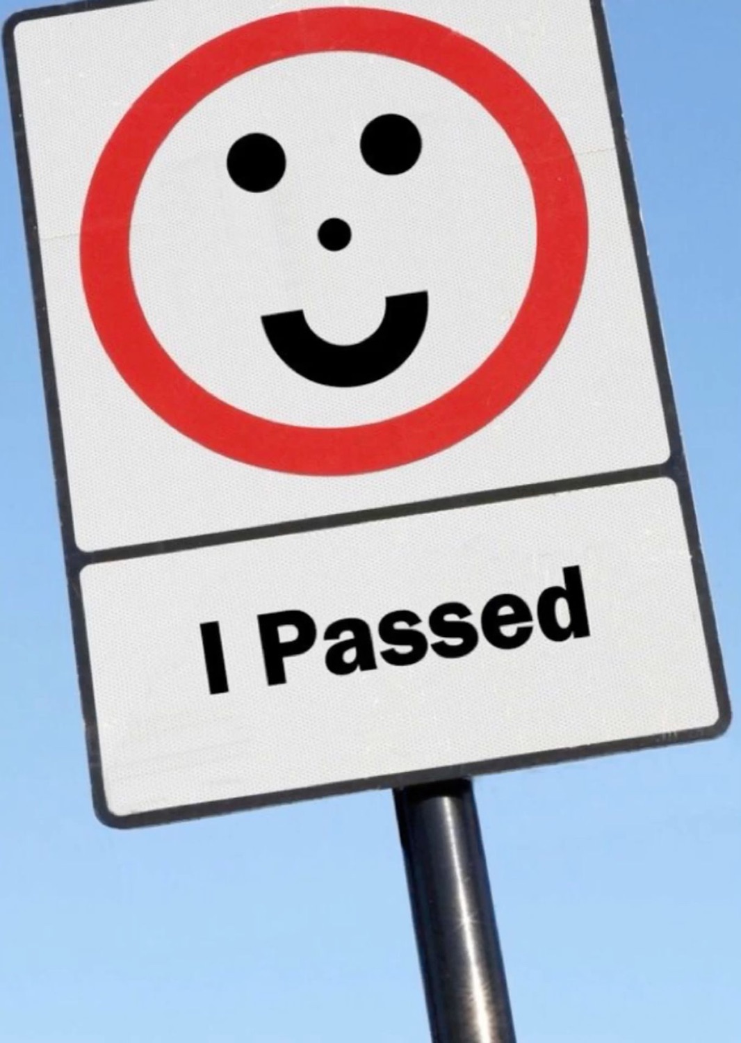 Road sign with a smiley: 'I Passed'