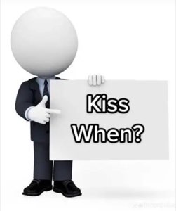 3D suit guy pointing at a sign that just says 'Kiss When?'