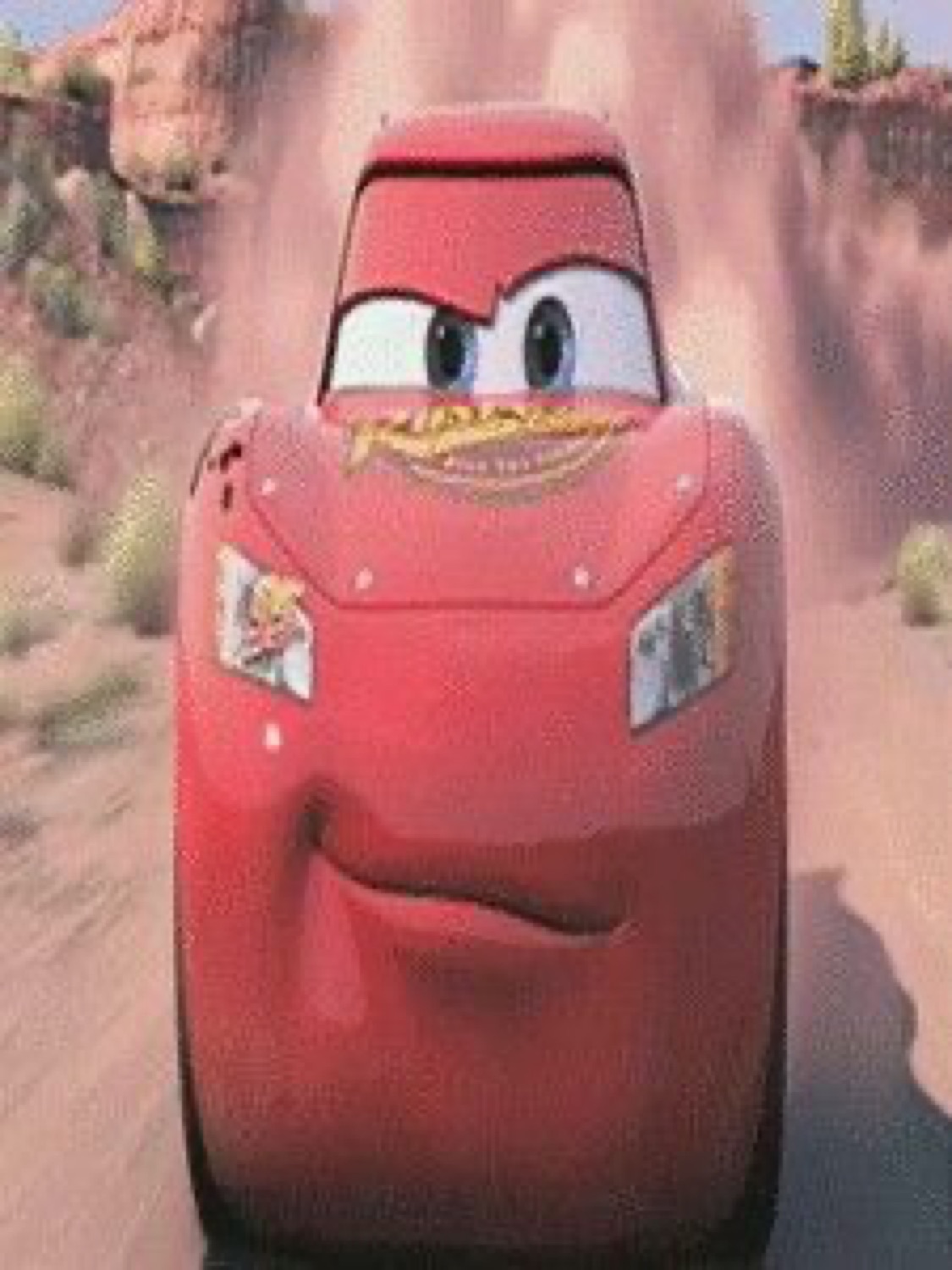Stretched-tall McQueen speeding toward the camera