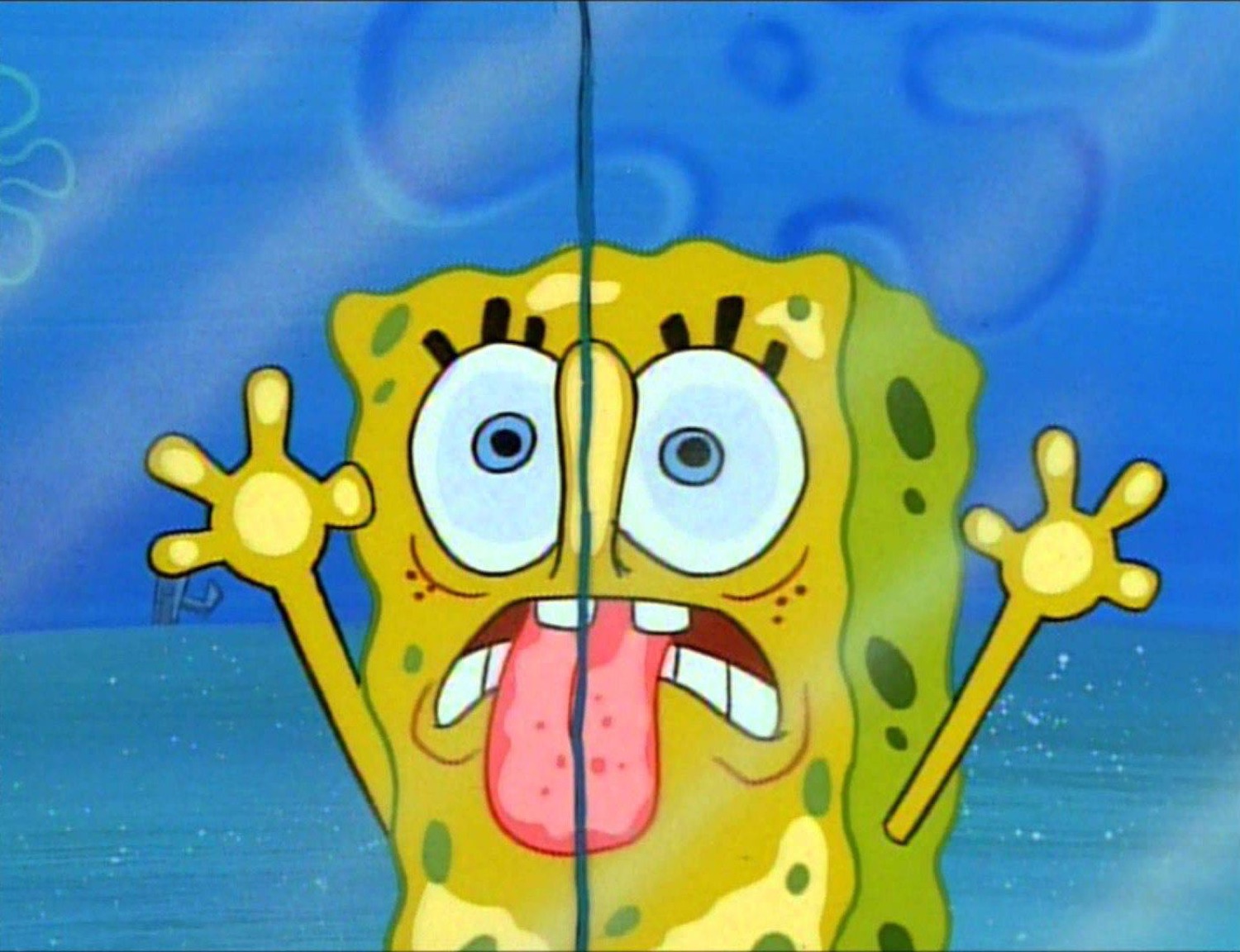 SpongeBob frozen mid-panic with his tongue out and hands raised in full meltdown mode