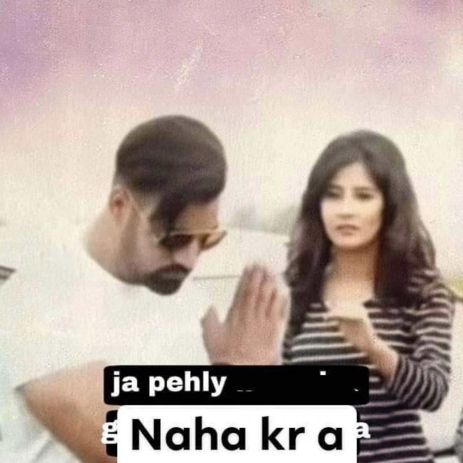 Man holding a hand up to a woman: 'ja pehly Naha kr a' (go take a bath first)