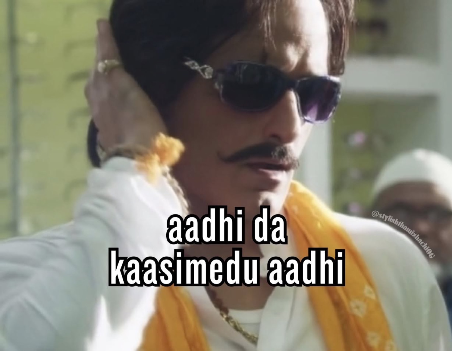 Mustached man in sunglasses adjusting his hair, captioned 'aadhi da kaasimedu aadhi'