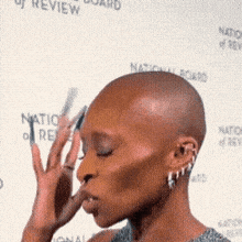 Cynthia Erivo thinking tapping head