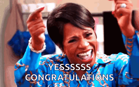 Woman laughing and cheering with excitement, "Yesssss congratulations"