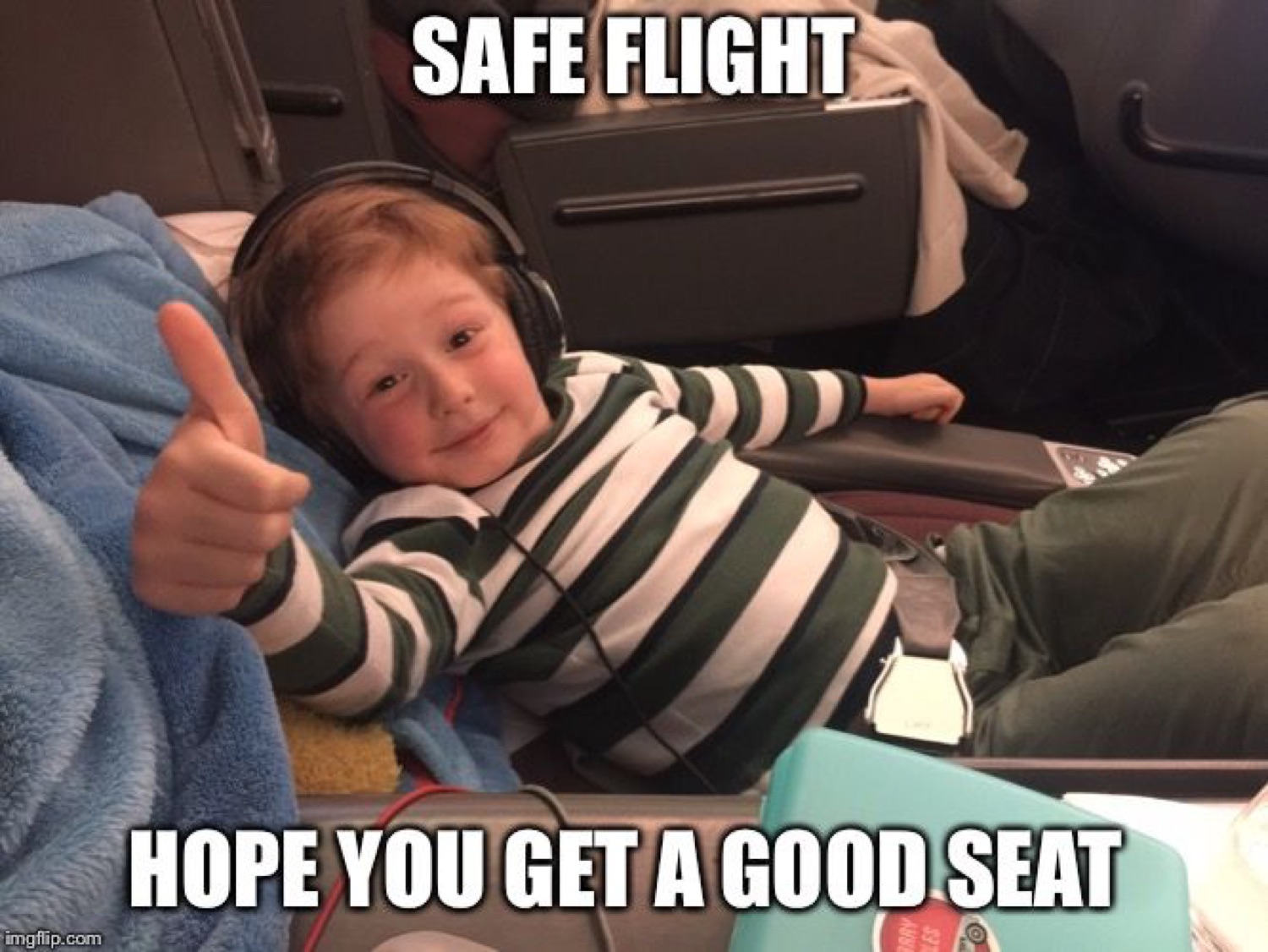 Kid on a plane giving a thumbs-up: 'SAFE FLIGHT / HOPE YOU GET A GOOD SEAT'