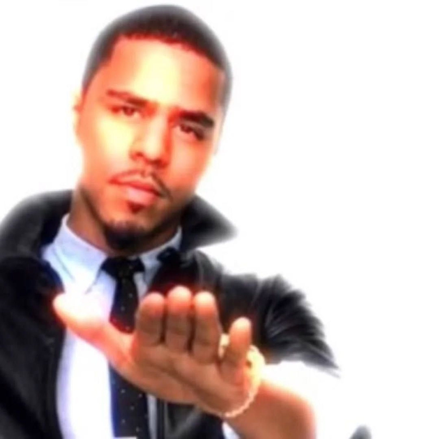 Man in a suit reaching a hand toward the camera with a smooth 'come here' look