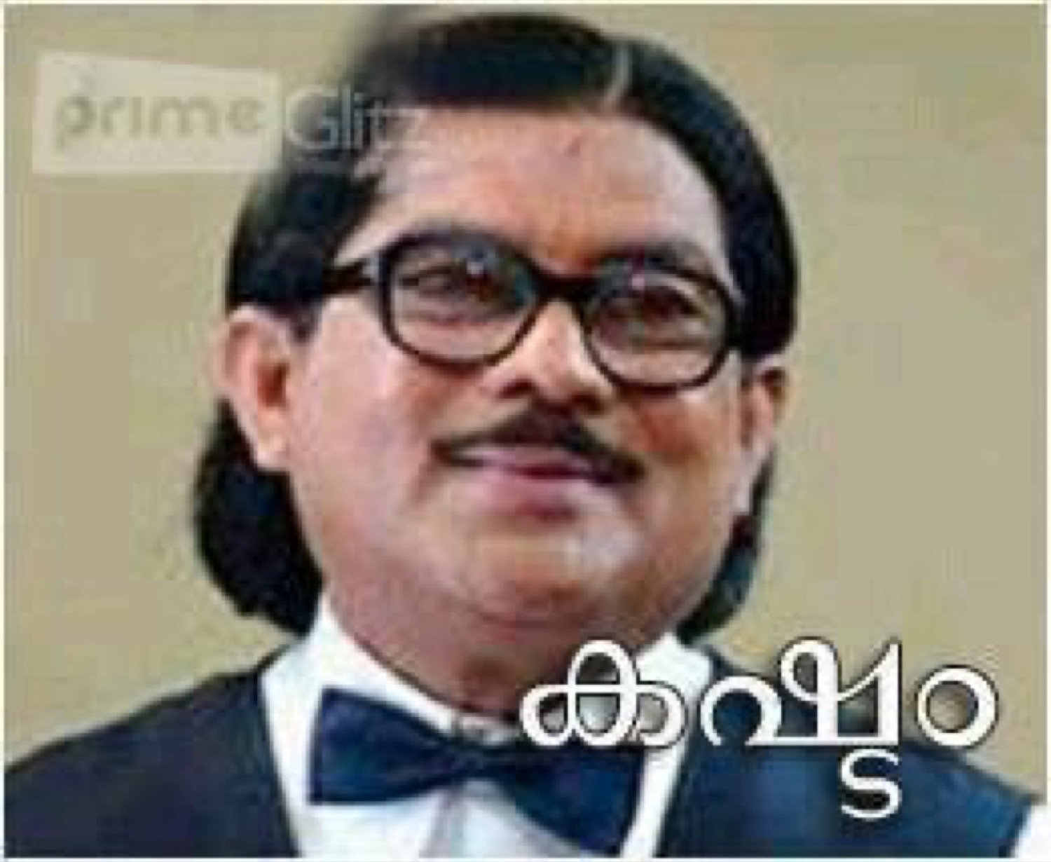 Old man in glasses and bow tie: 'കഷ്ടം' (what a pity)