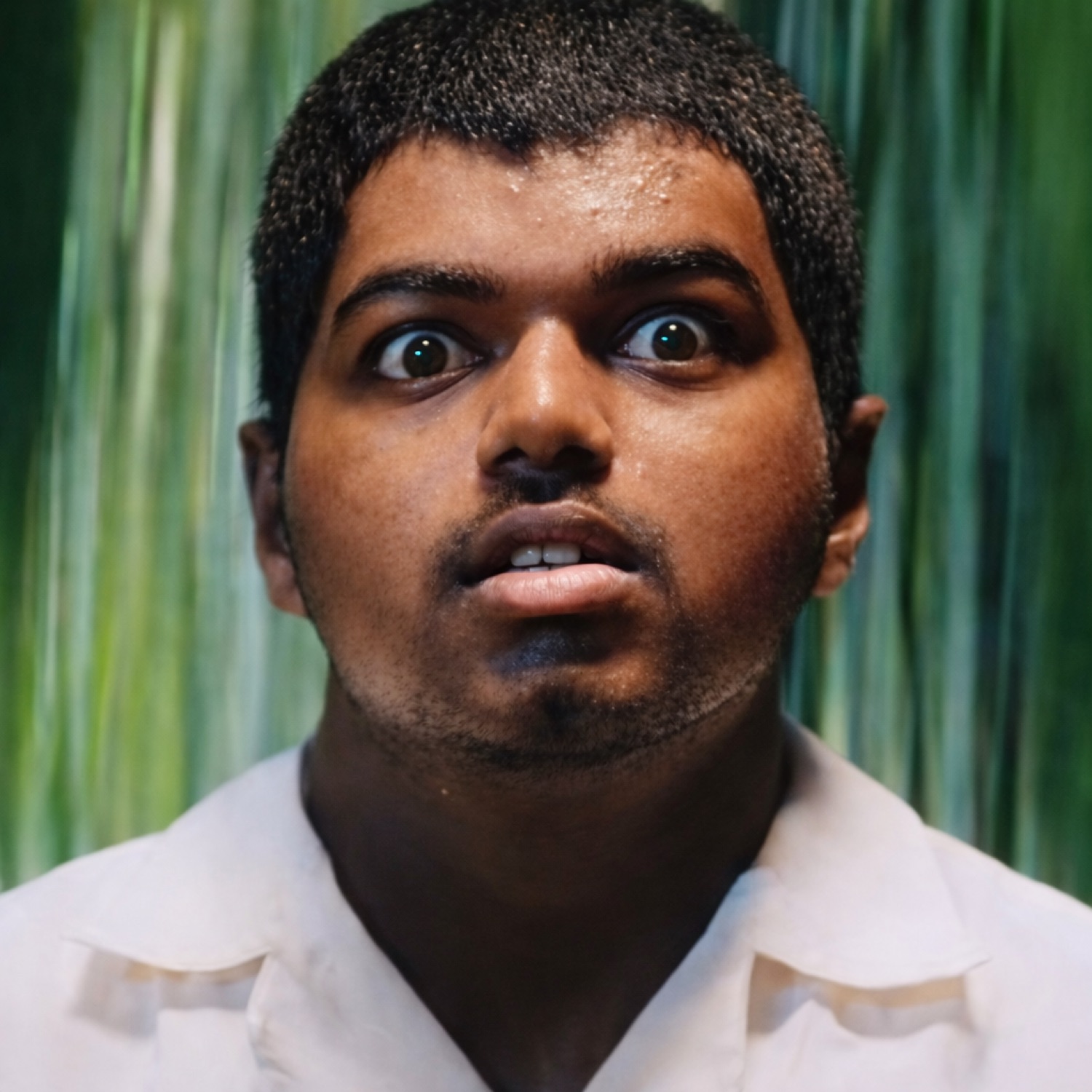 Young man staring with huge wide eyes