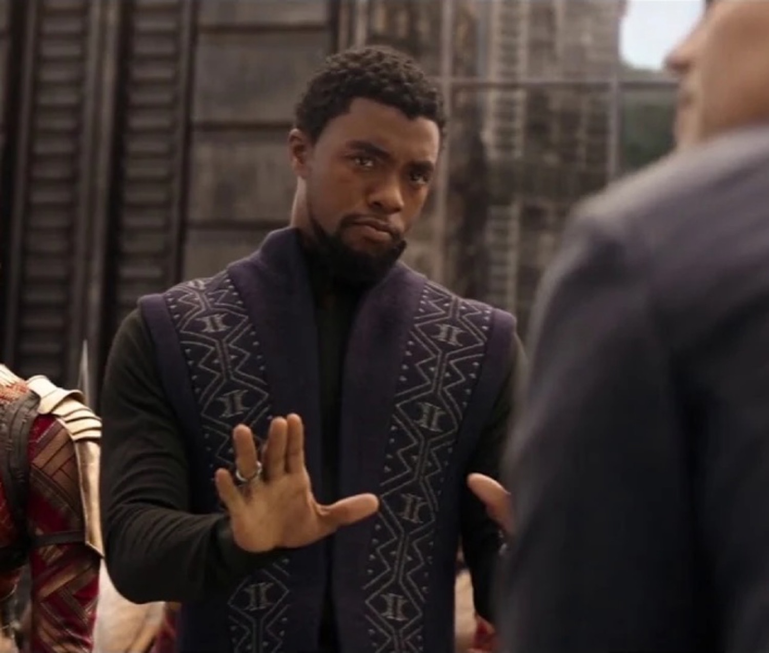 T'Challa in Wakandan garb holding up a hand like 'absolutely not, stop right there'