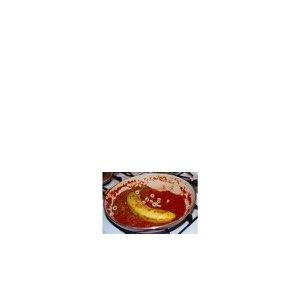 A banana sitting in a pan of tomato sauce with cereal hoops — deeply unhinged meal