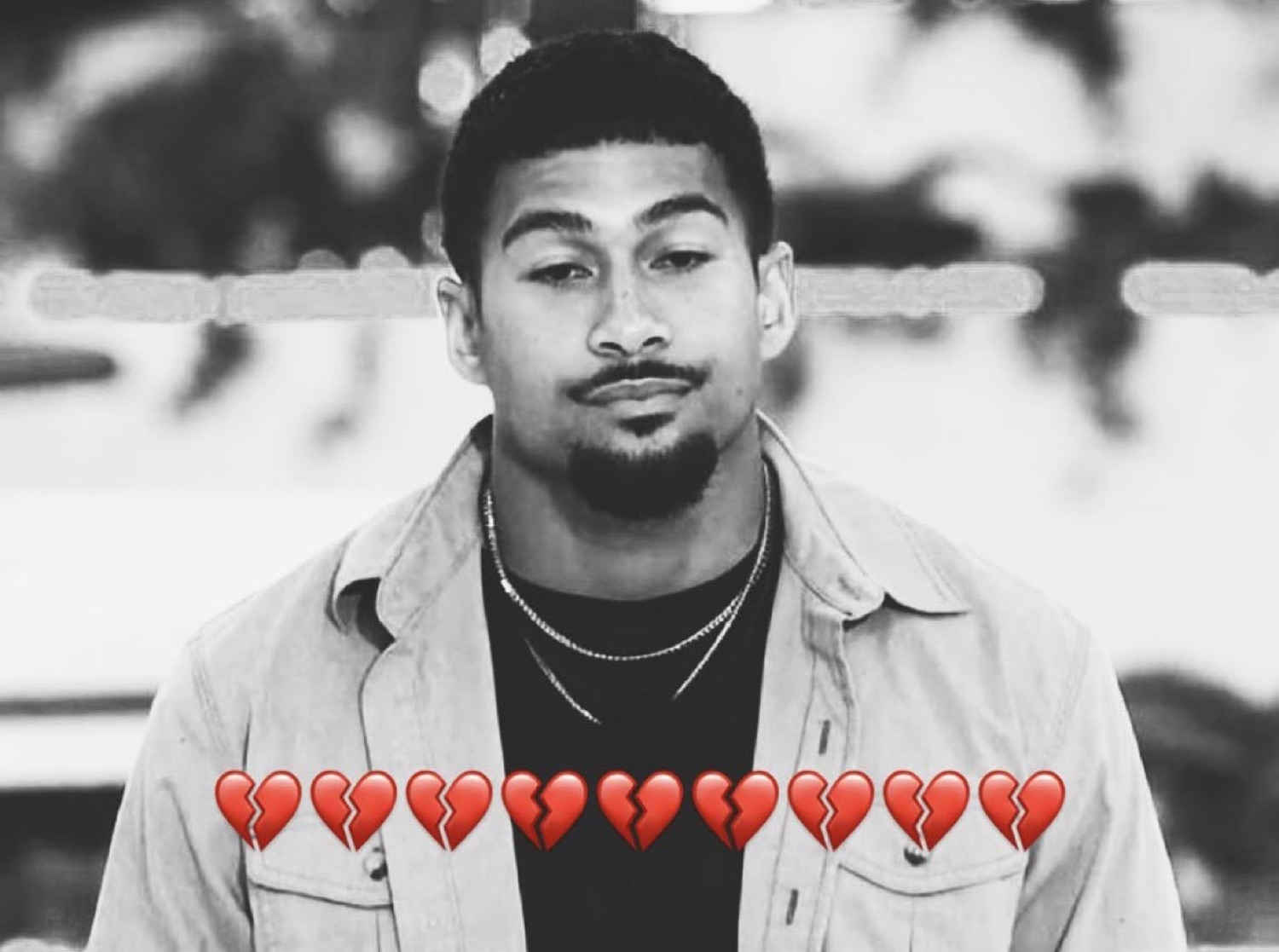 Black-and-white Love Island islander with a sad pout above a row of broken-heart emoji