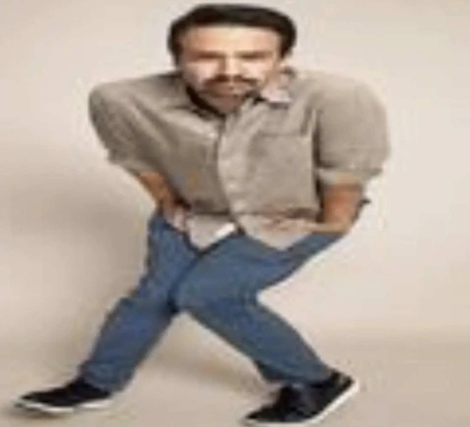Man standing pigeon-toed with an awkward, nervous pose