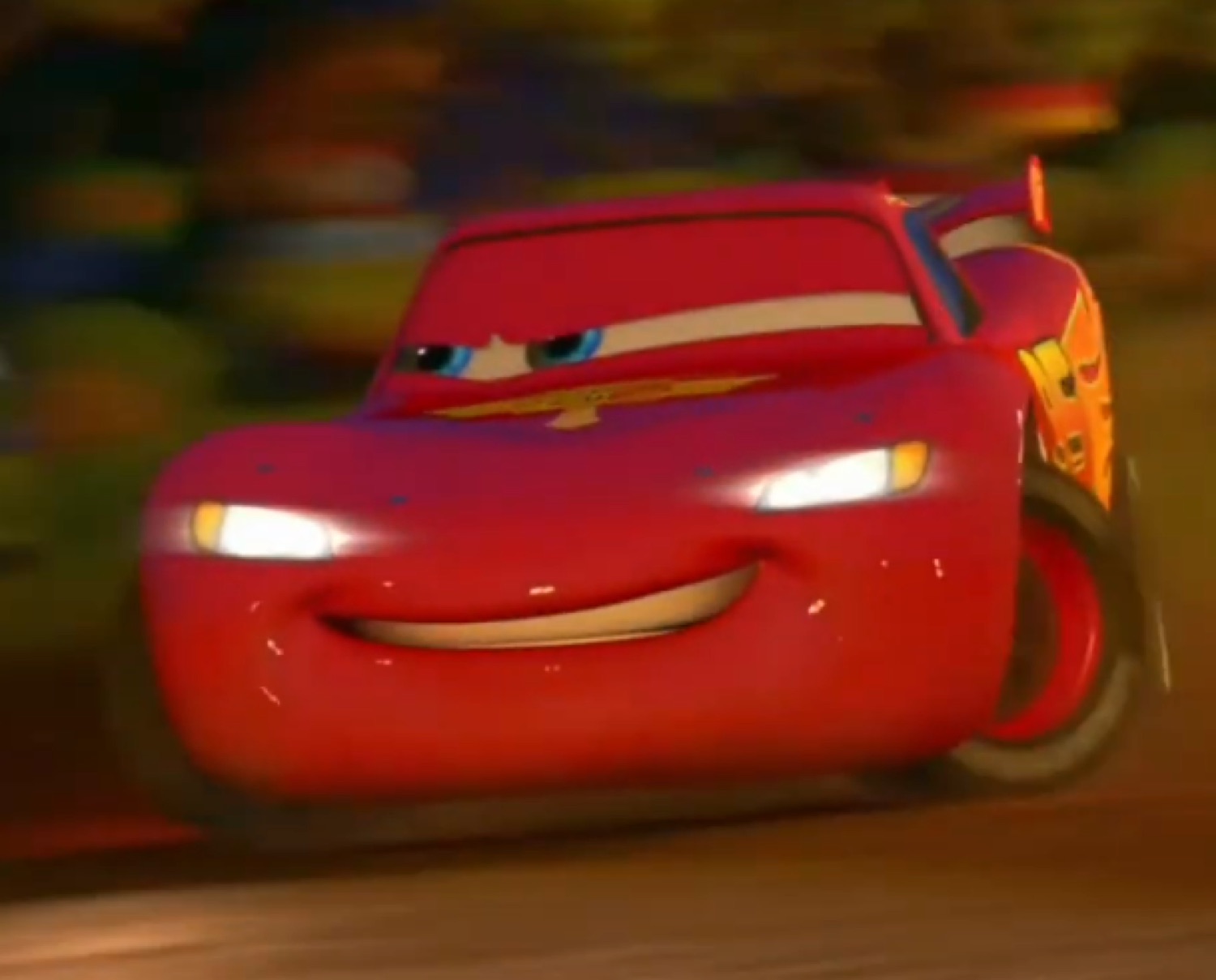 McQueen with a smug determined grin in the dark