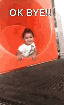 Little girl sliding away down a red tube slide, "OK BYE!!"