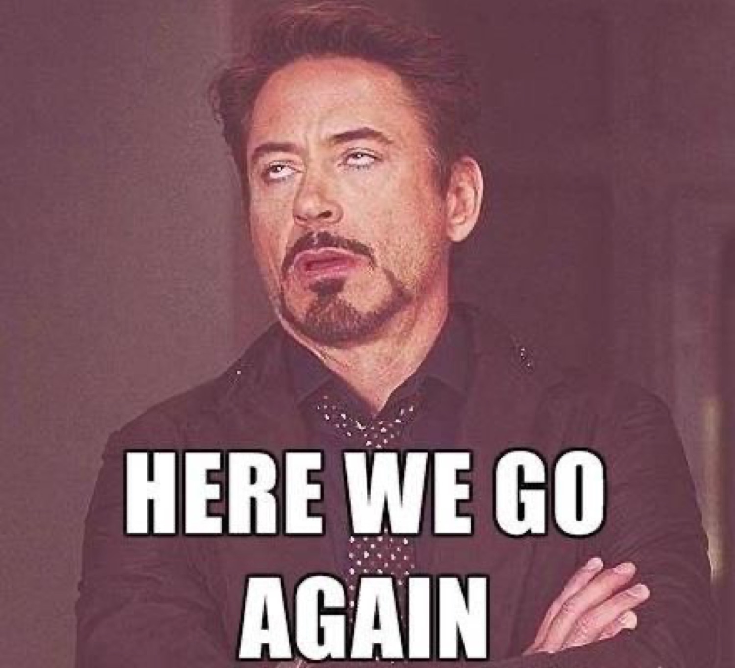 Robert Downey Jr. rolling his eyes captioned 'HERE WE GO AGAIN'