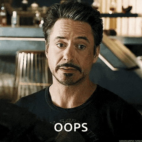 Robert Downey Jr. with an awkward grimace, "Oops"