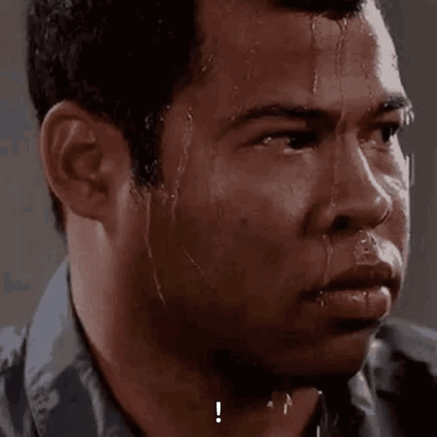 Jordan Peele sweating nervously and glancing to the side