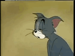 Tom from Tom and Jerry propping his eyes open trying to stay awake