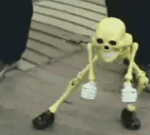 Yellow toy skeleton doing a jittery dance