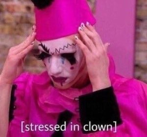Person in pink clown makeup gripping their head, captioned '[stressed in clown]'
