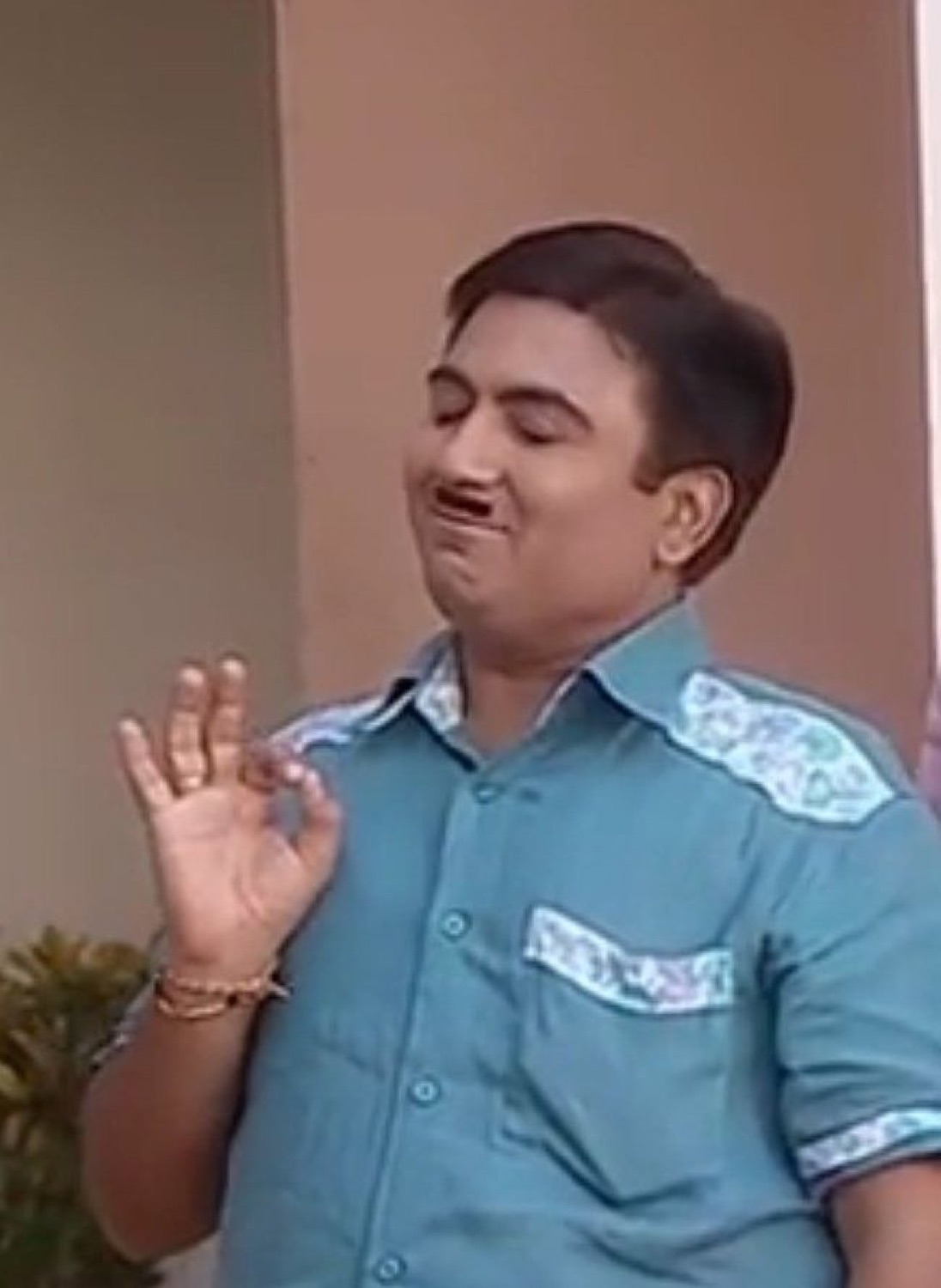 Jethalal from Taarak Mehta pursing his lips with a sly sideways glance