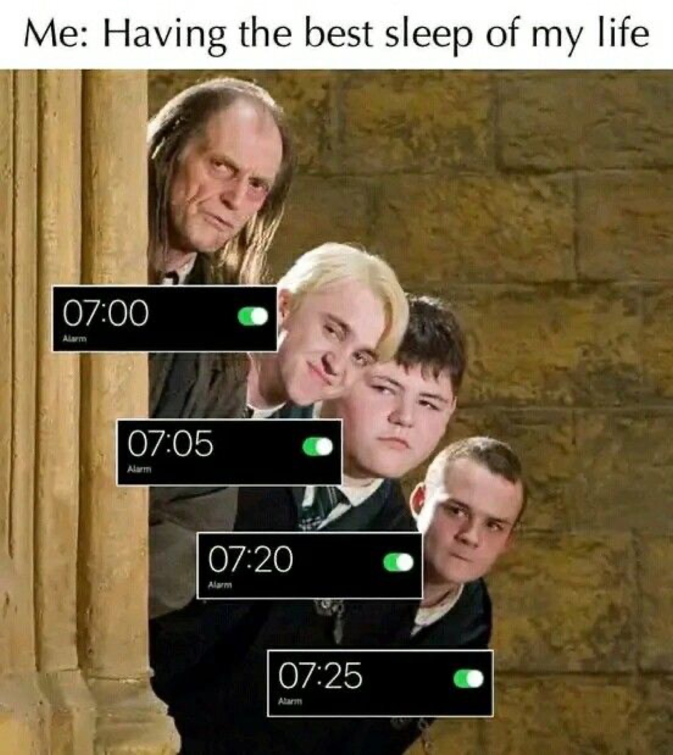 Filch, Draco, Crabbe and Goyle peeking around a pillar with stacked alarms 07:00-07:25 under 'Me: Having the best sleep of my life'