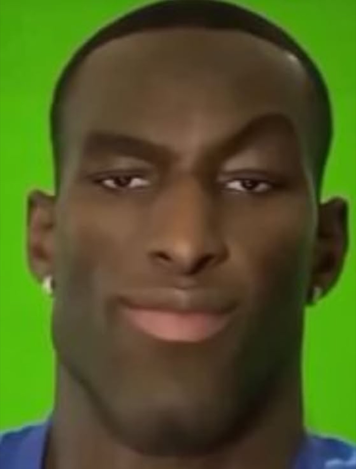 Guy on a green screen with a smug, knowing look