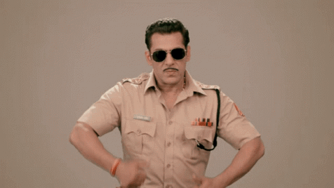 Salman Khan as Chulbul Pandey in Dabangg doing his collar dance in sunglasses