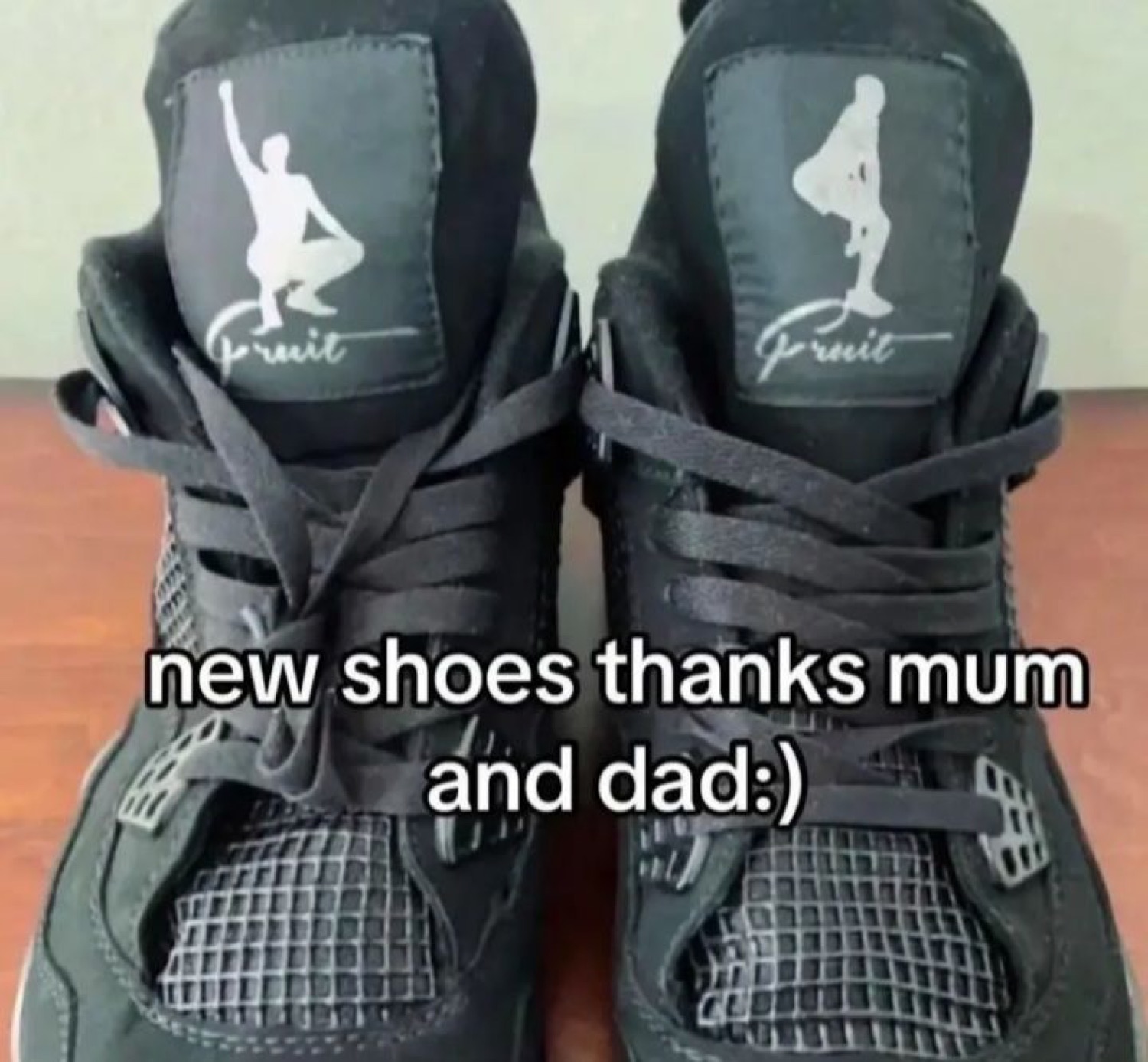 Sneakers with a squatting-man 'Fruit' logo under 'new shoes thanks mum and dad:)'