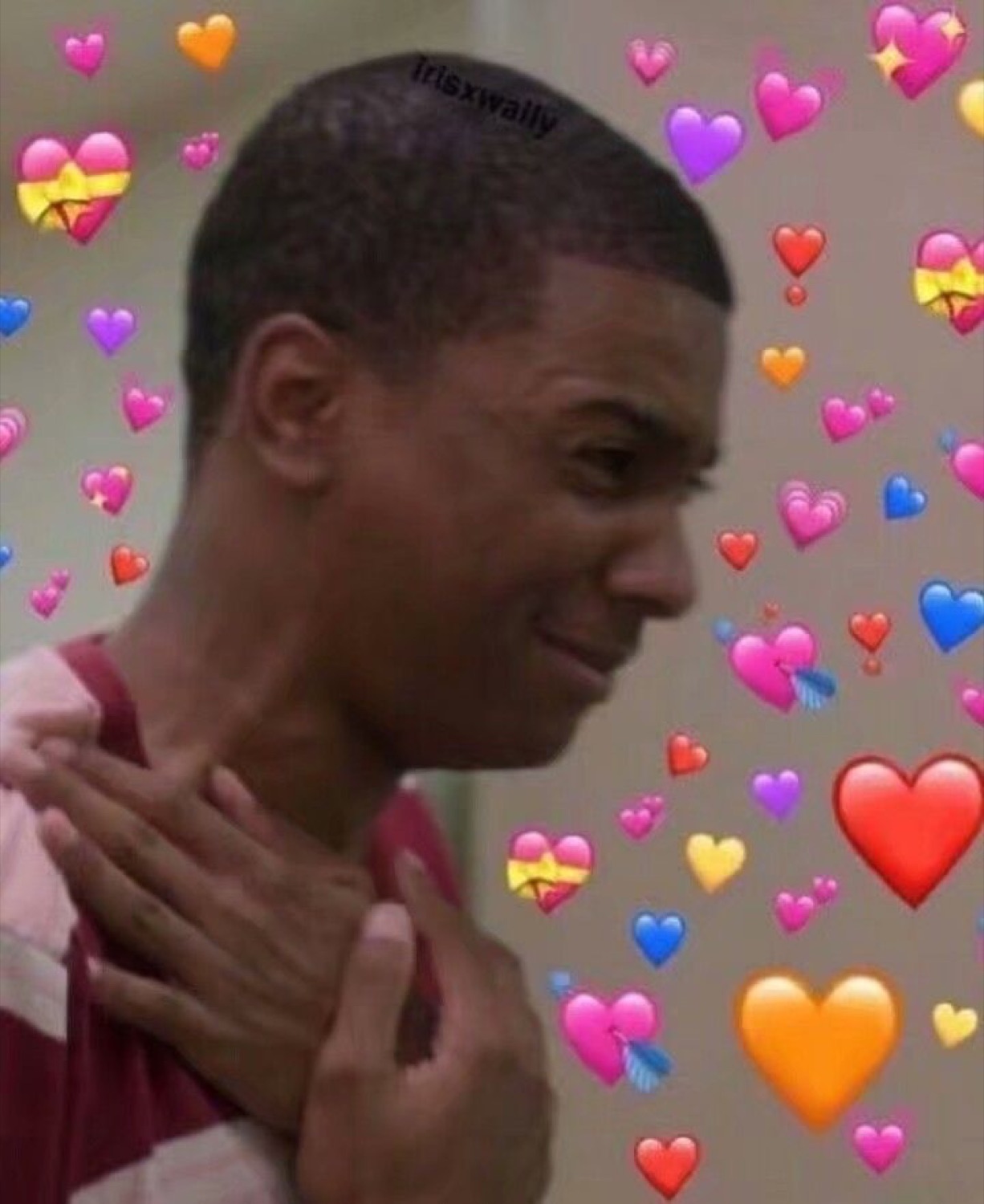 Young man clutching his chest with a bashful smile surrounded by floating heart emojis