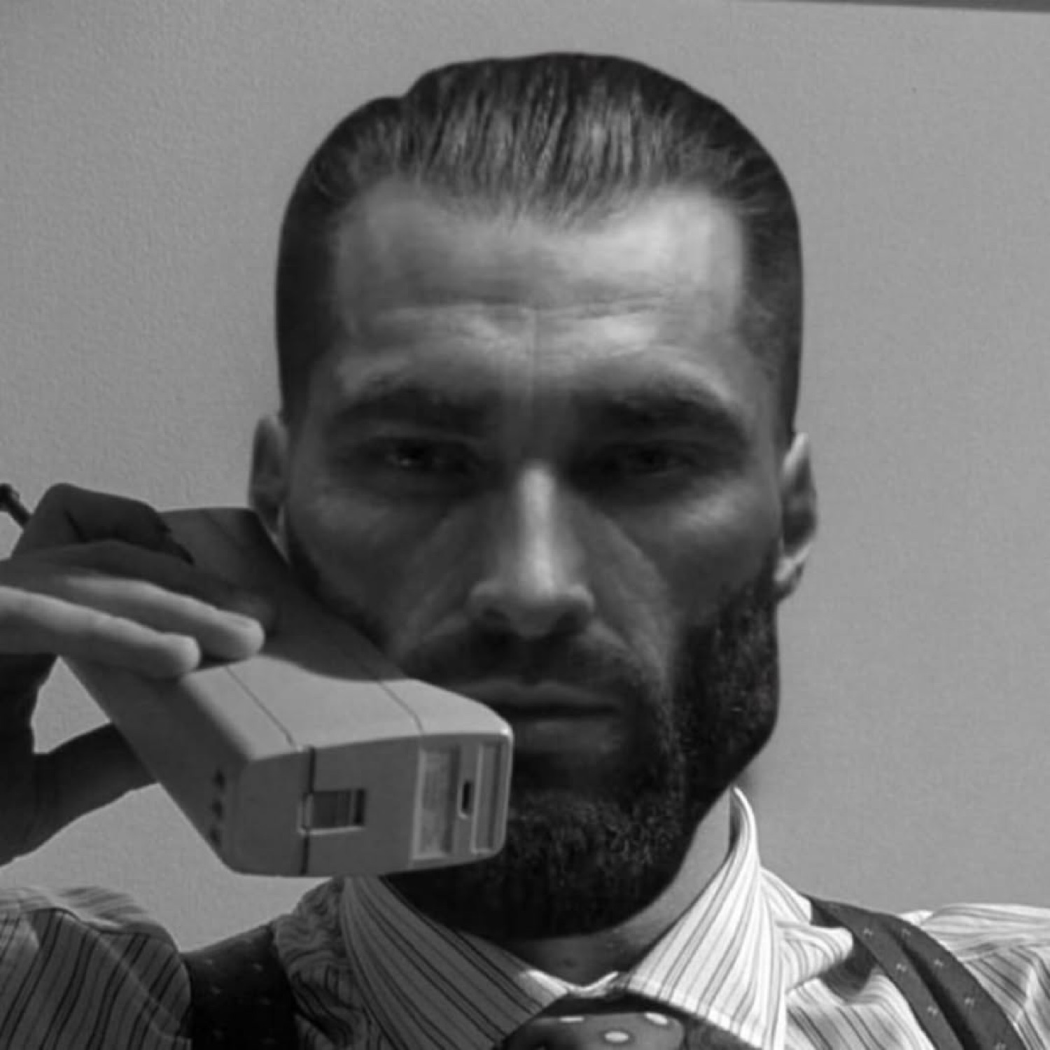 Gigachad on a brick phone in black and white