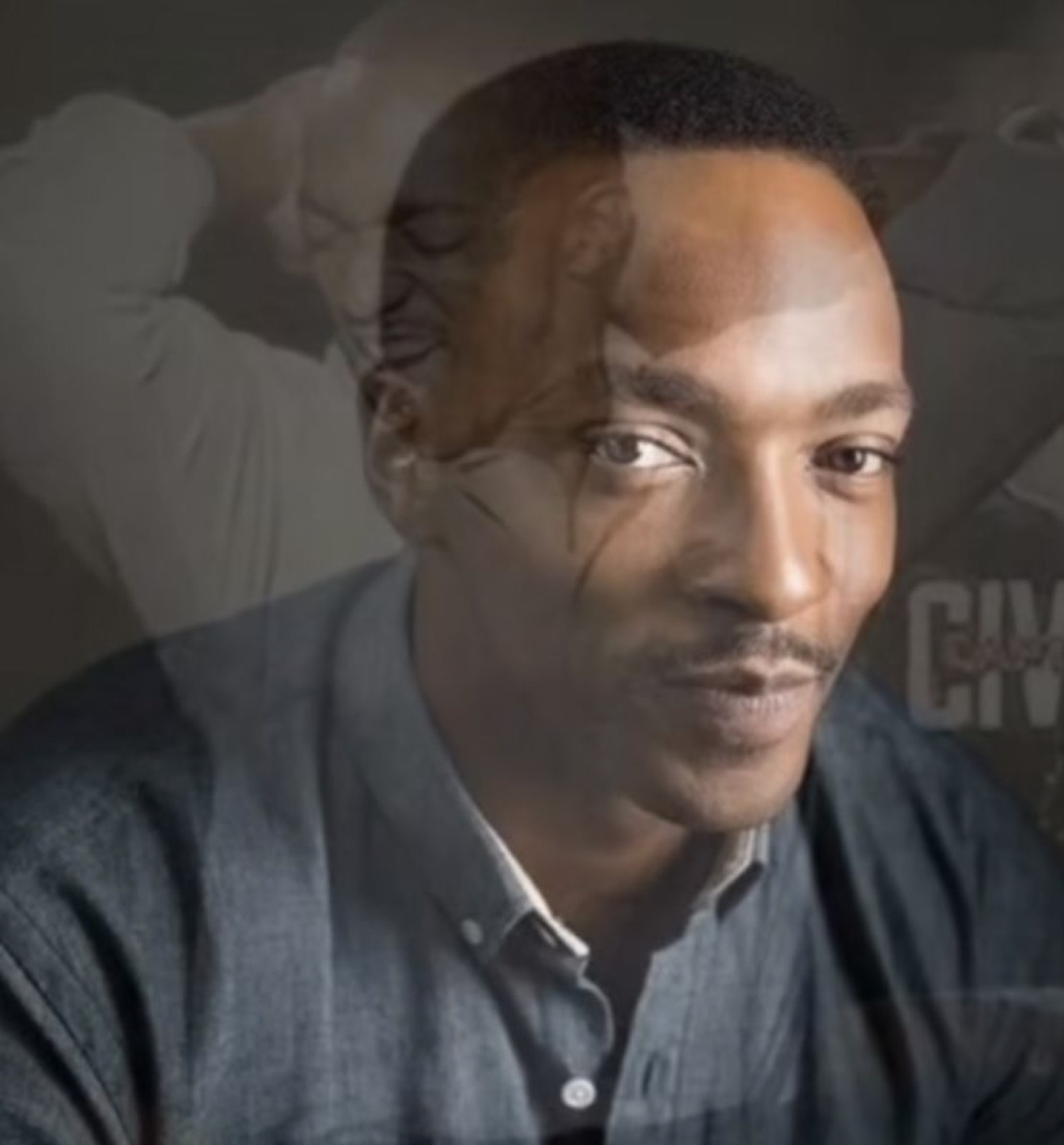 Anthony Mackie looking calm and reflective with a ghost image layered behind him