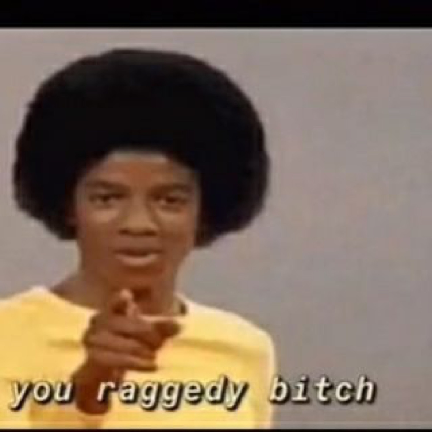 Young Michael Jackson pointing directly at you captioned 'you raggedy bitch'