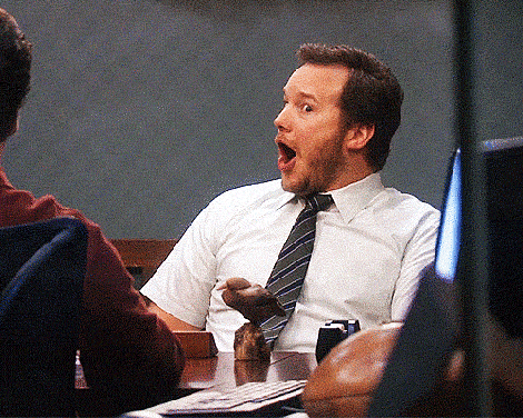 Chris Pratt as Andy Dwyer in Parks and Rec with his jaw dropped in shock