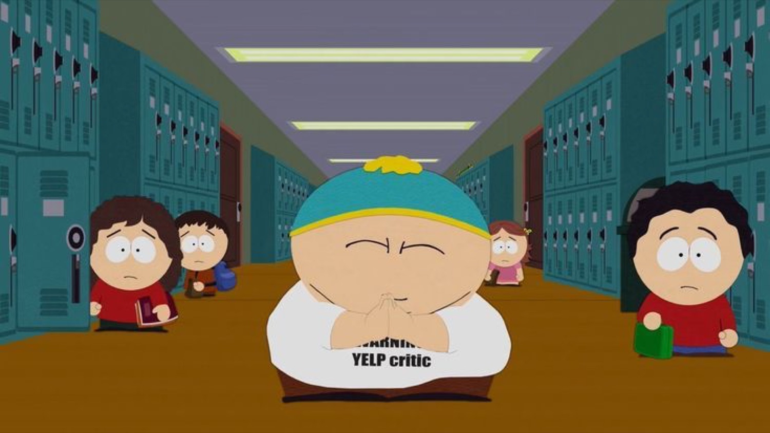 Cartman from South Park in a 'Yelp critic' shirt walking a school hallway with a smug squint