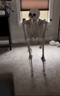 Skeleton standing in a living room then collapsing into a pile of bones