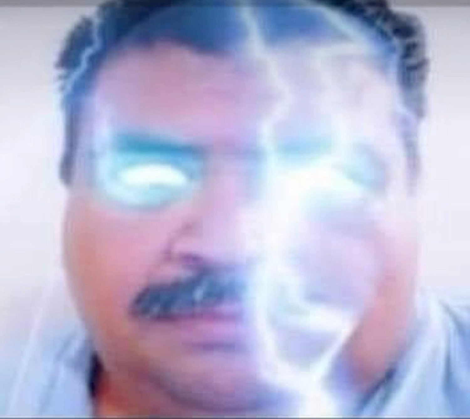 Mustached man with beams of light blasting out of his glowing eyes