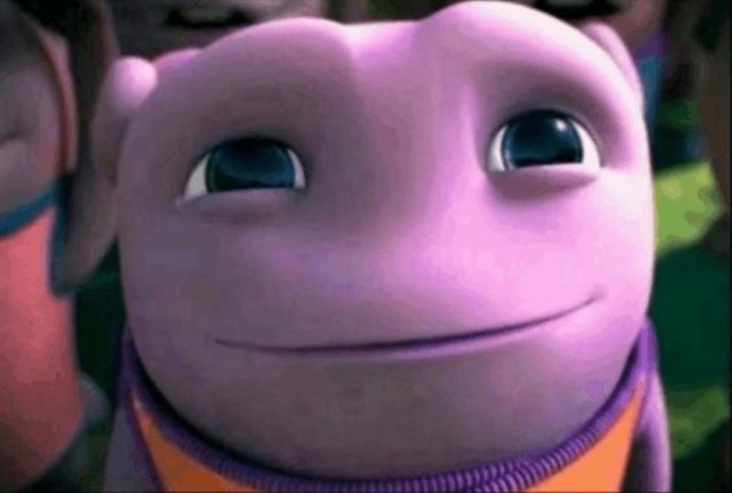 Oh from DreamWorks' Home grinning with wide eyes