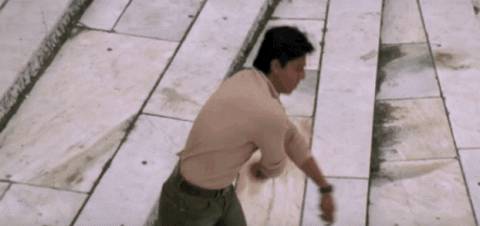 Shah Rukh Khan spreading his arms wide in his signature pose
