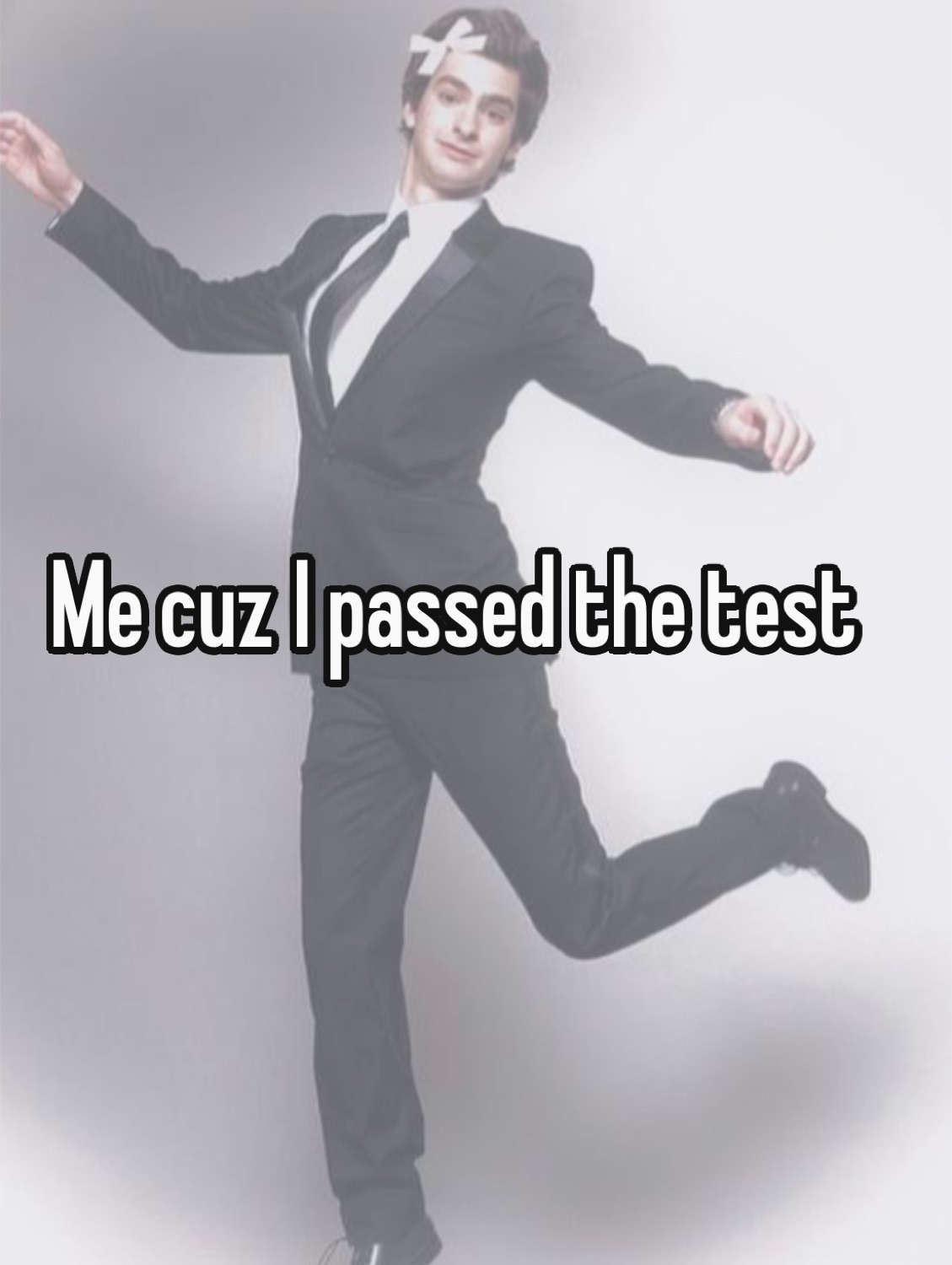 Man in a suit floating mid-leap: 'Me cuz I passed the test'
