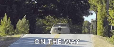 Van speeding down a country road, "On the way"