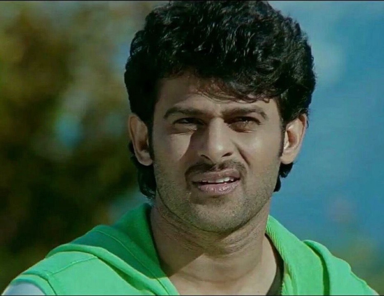 Prabhas squinting with a confused grimace
